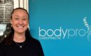 Claire in front of Body Pro Chiropractic