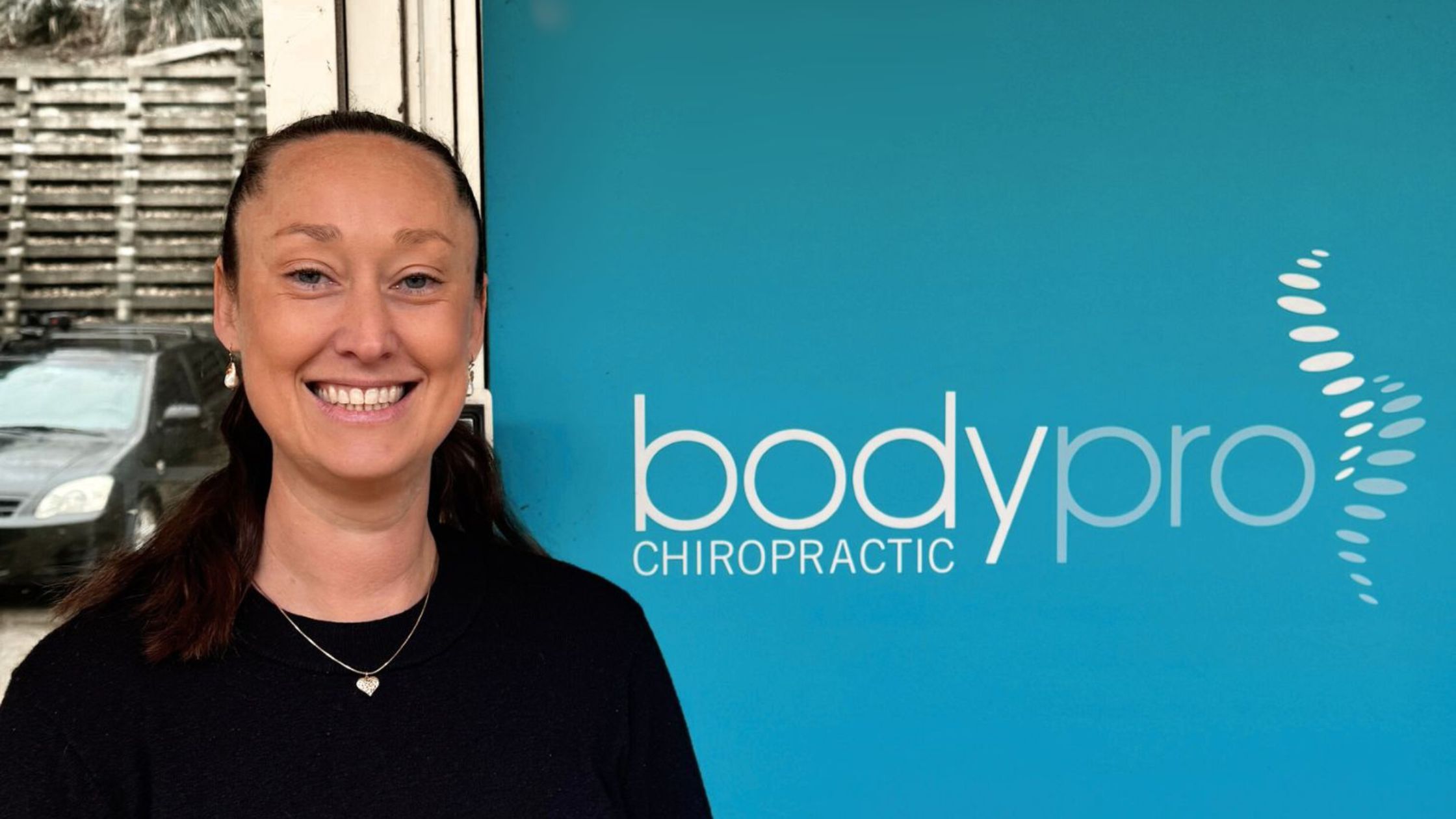 Claire in front of Body Pro Chiropractic